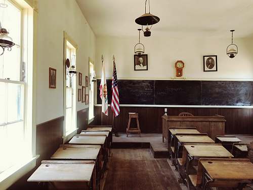 school room flag of USA standing near blackboard room